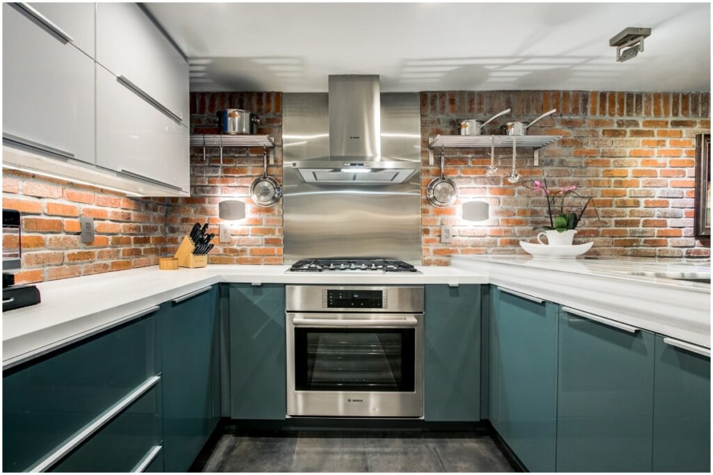 kitchen with exposed brick wall