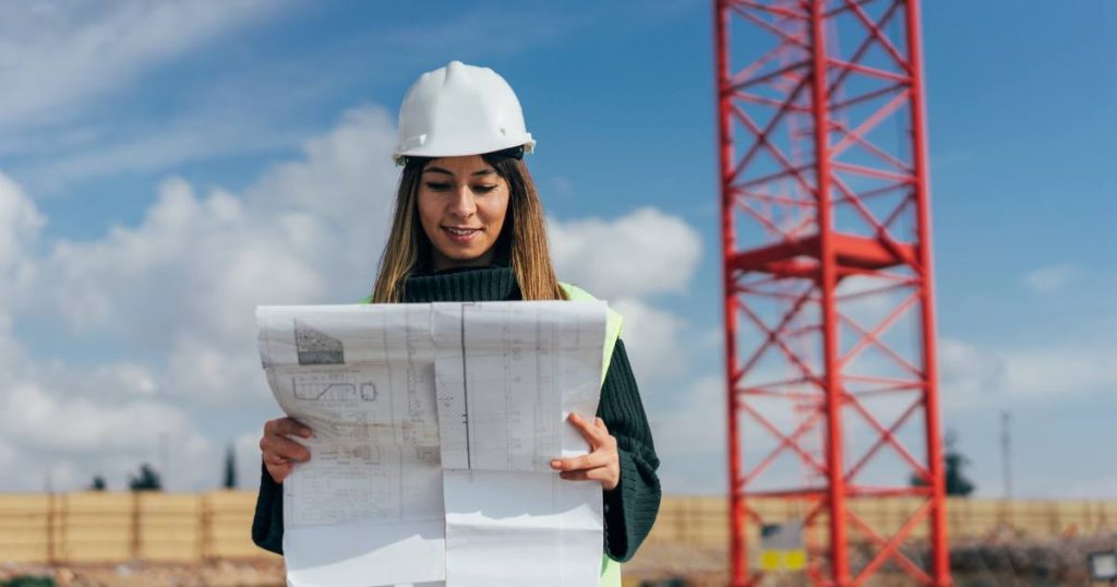 Specialty construction project general contractor reviewing design-build plans.