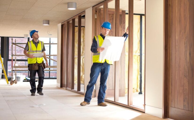 General contractor reviewing technology for office fit out