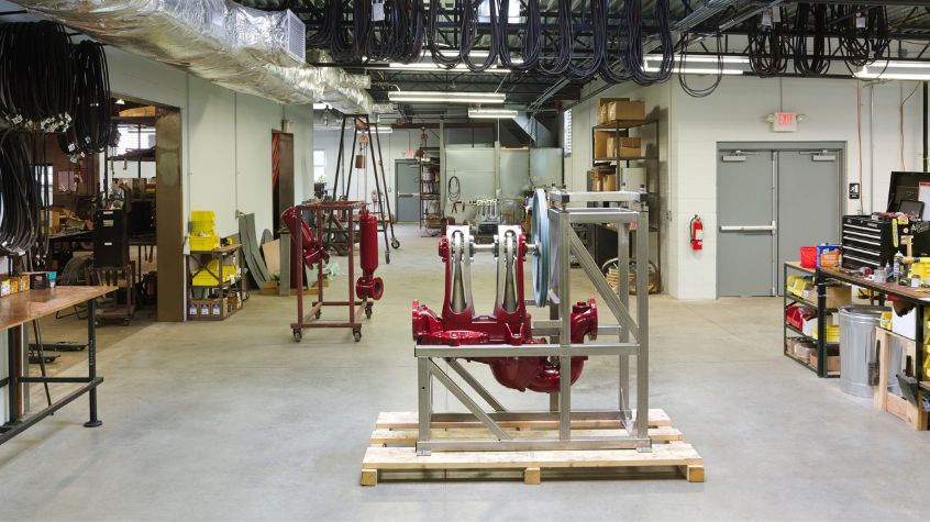 Industrial manufacturing shop with equipment, work areas, and utility systems