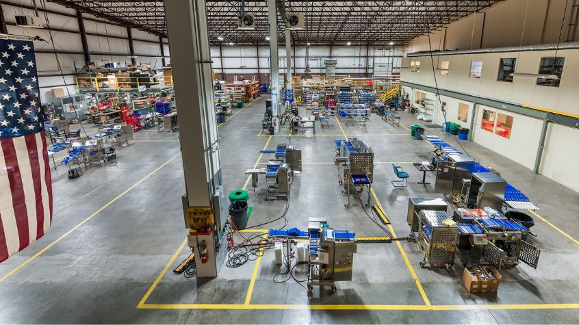 Manufacturing facility construction with organized production areas and equipment